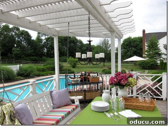 A stunning 'Pottery Barn Knock-off' outdoor candle chandelier creating a warm glow on a patio or deck.