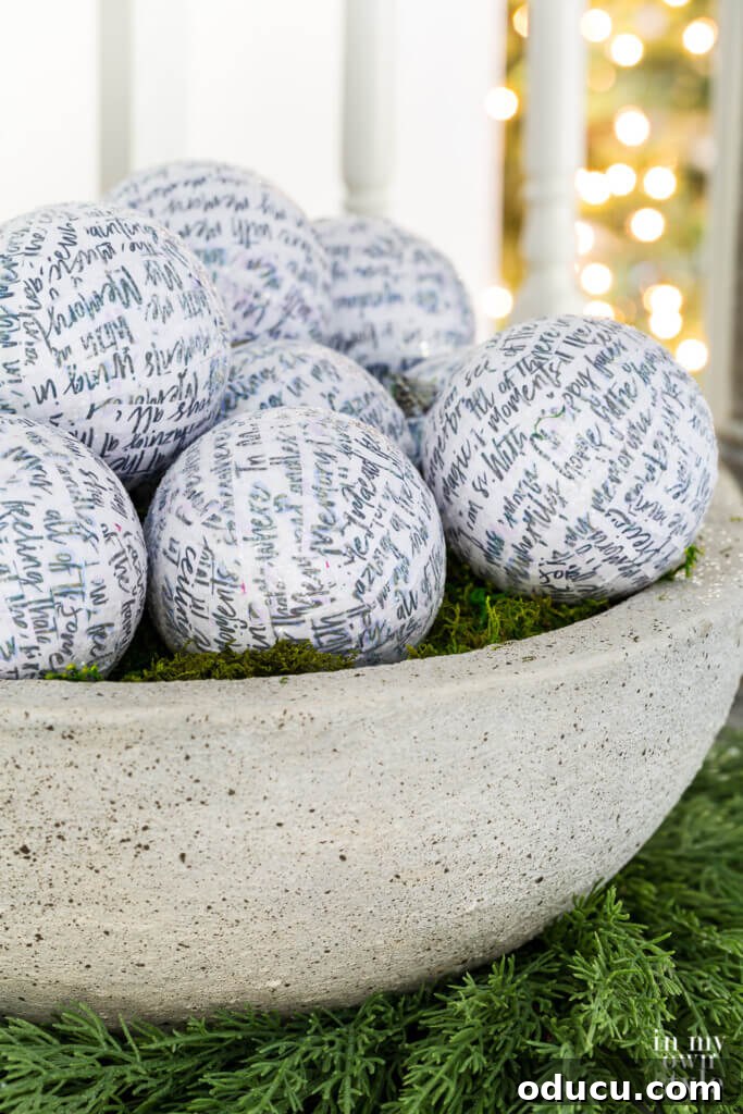 El Yapımı Dekupaj Yılbaşı Süsleri 2 DIY faux large cast stone planter bowl filled with white glittered Christmas ornaments.