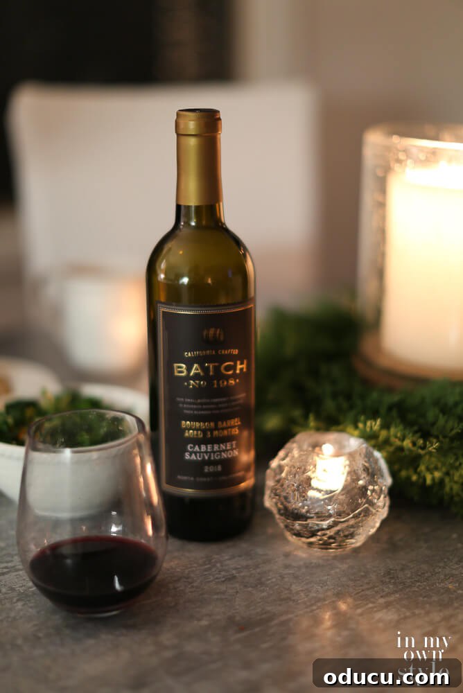 wine on table with candles and glasses