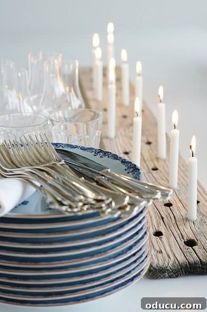 Effortless Christmas Table Wreath Crafts 8 Stack of plates and utensils with a wood plank candle holder