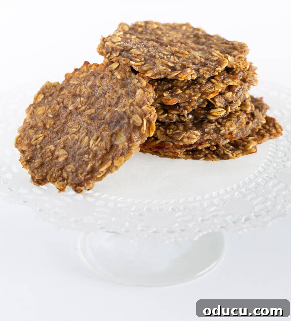 My Personal Weight Loss Victory 15 Healthy banana oatmeal cookies on a white plate stand.