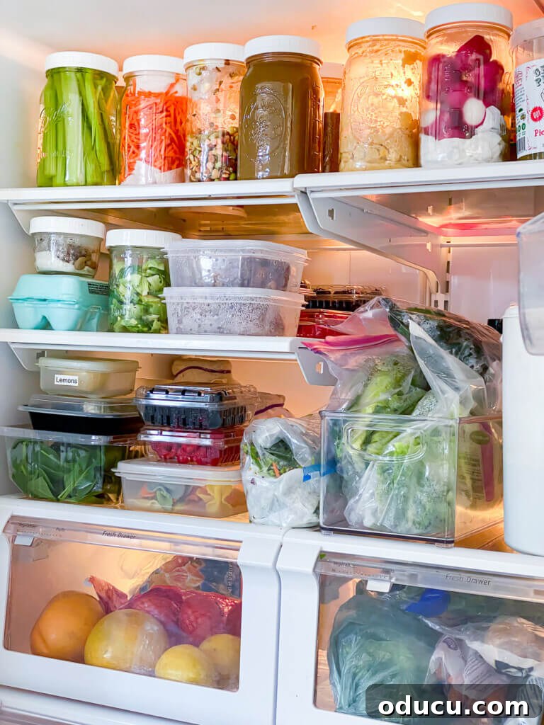 My Personal Weight Loss Victory 7 Plant Based organized refrigerator using wide mouth Mason jars to organize cut up veggies and more to make plant based eating easier.