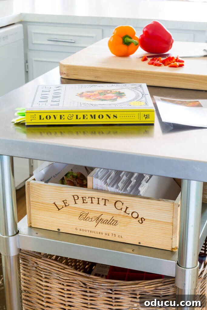 My Personal Weight Loss Victory 8 Kitchen island card with cookbook on top and cutting board on top. A wine box repurposed into a recipe box on second shelf. Makes it easier to eat a plant-based diet.