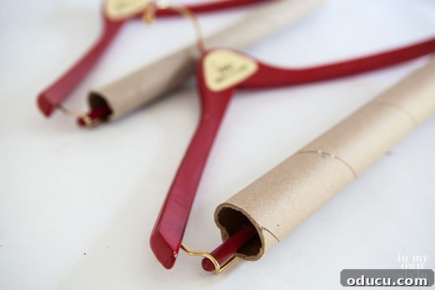 Brilliant DIY Strategies for a Perfectly Organized Home 4 Instructions for adding cardboard tubes to hangers for wrinkle-free storage.