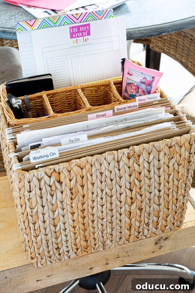 Creative File Solutions for Your Home Workspace 10 Hanging file folder holder with an inside basket for office supplies – a creative file storage idea for remote work.