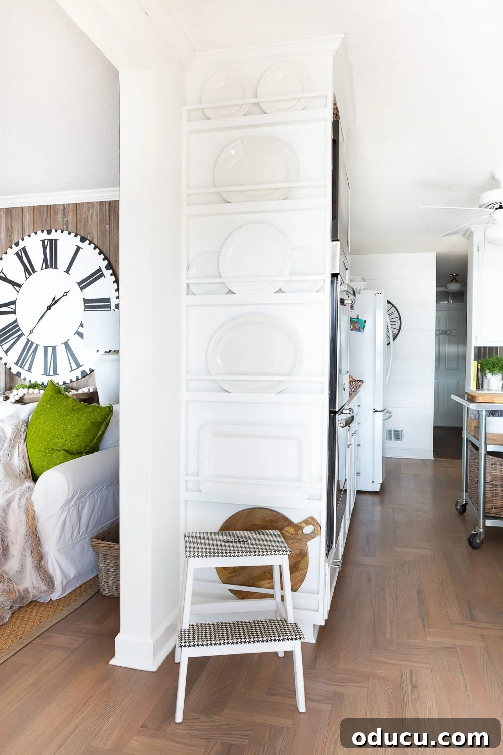 DIY Floor-to-Ceiling Wall Plate Rack 20 Finished floor-to-ceiling built-in DIY plate rack wall filled with white plates.