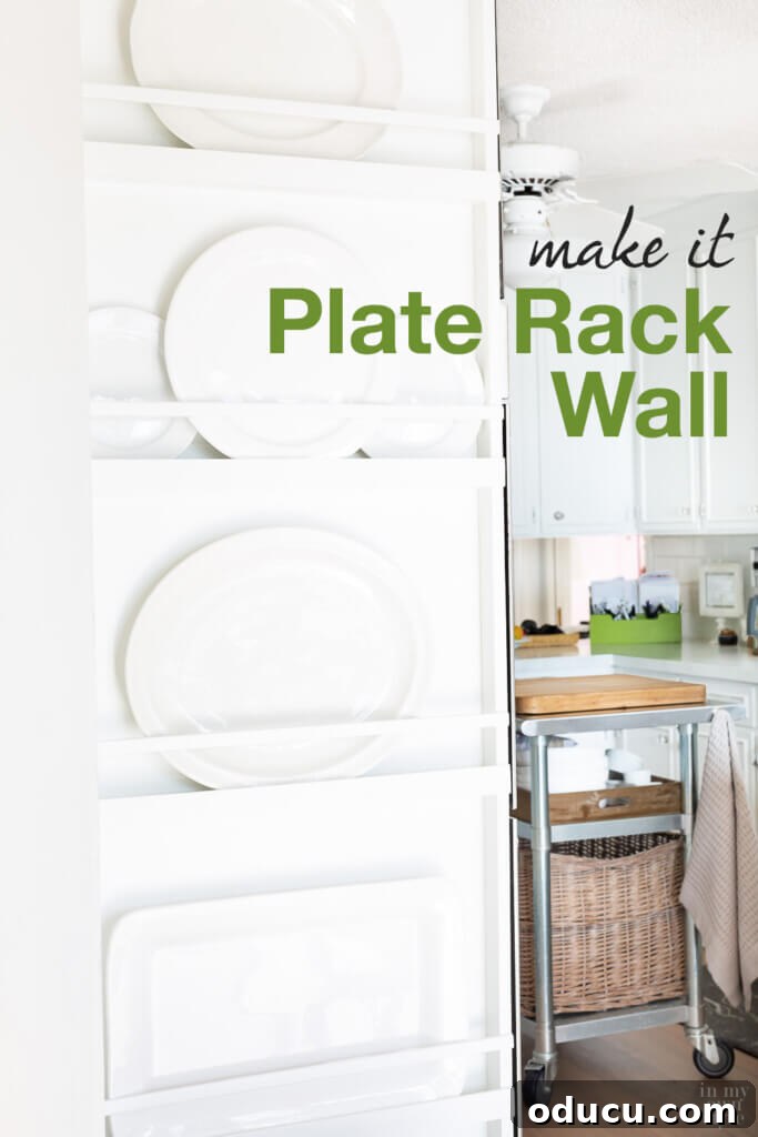 DIY Floor-to-Ceiling Wall Plate Rack 22 White kitchen with a floor-to-ceiling built-in plate rack wall, featuring text overlay 'Make It Plate Rack Wall'.