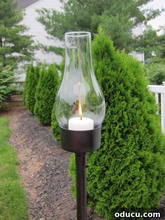 Upcycled Tuna Can Garden Lanterns 2 DIY outdoor lantern with glass globe made using a tuna can.
