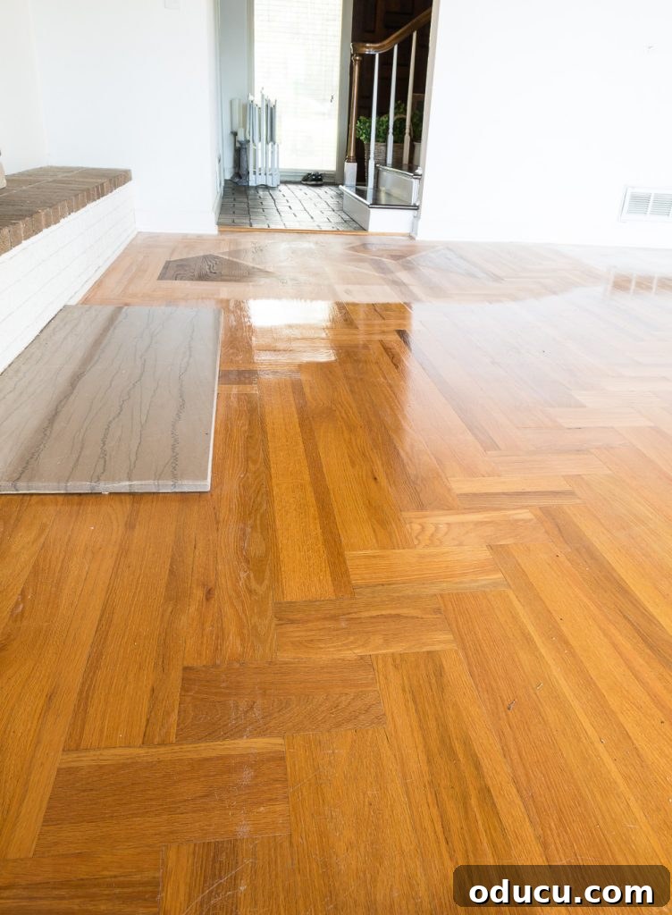 The Evolution of My Living Room Style 13 Orange toned wood floor with oil-based polyurethane before getting refinished with the Bona Hardwood Floor Refinishing System