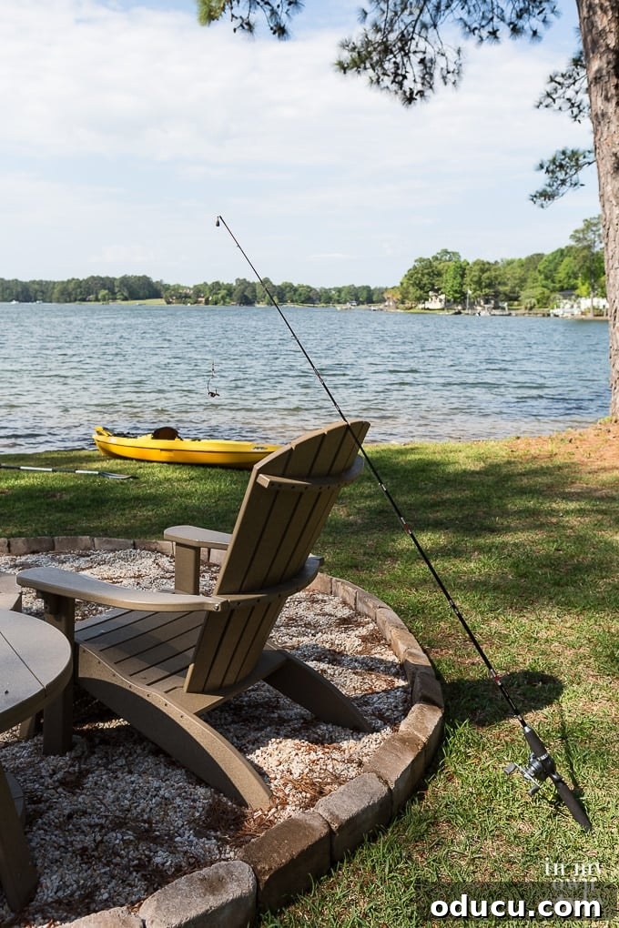 Uncover Your Personal Decorating Style 16 A comfortable chair and fishing pole in a yard along the serene shores of a lake.