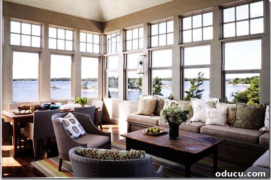 Uncover Your Personal Decorating Style 5 Living room with large windows offering a sweeping view of the sea.