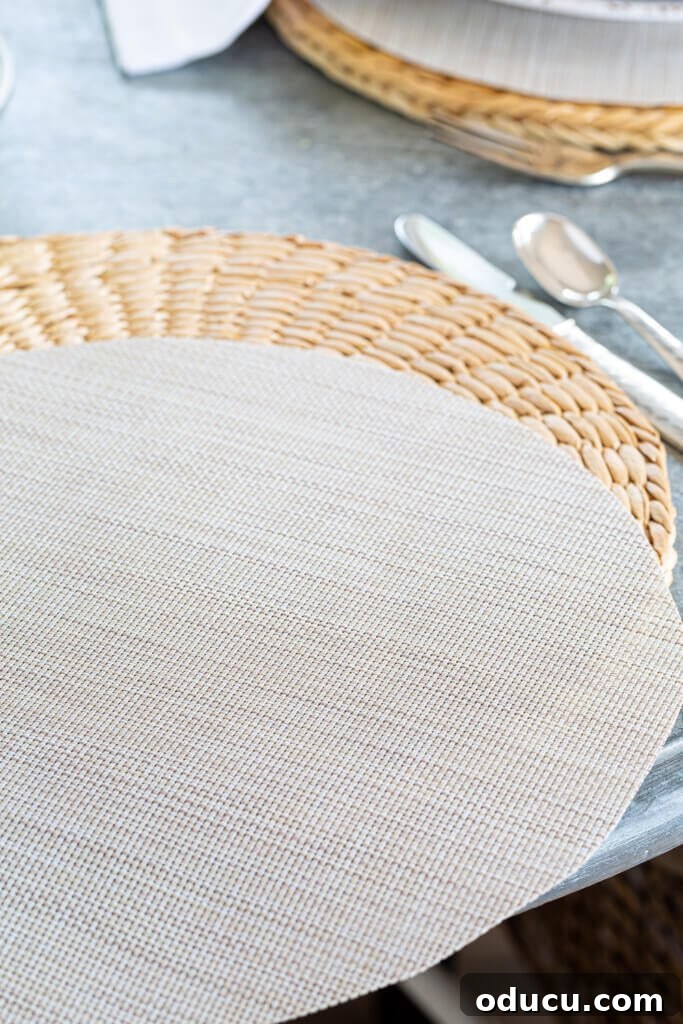 Two woven round placemats layered.