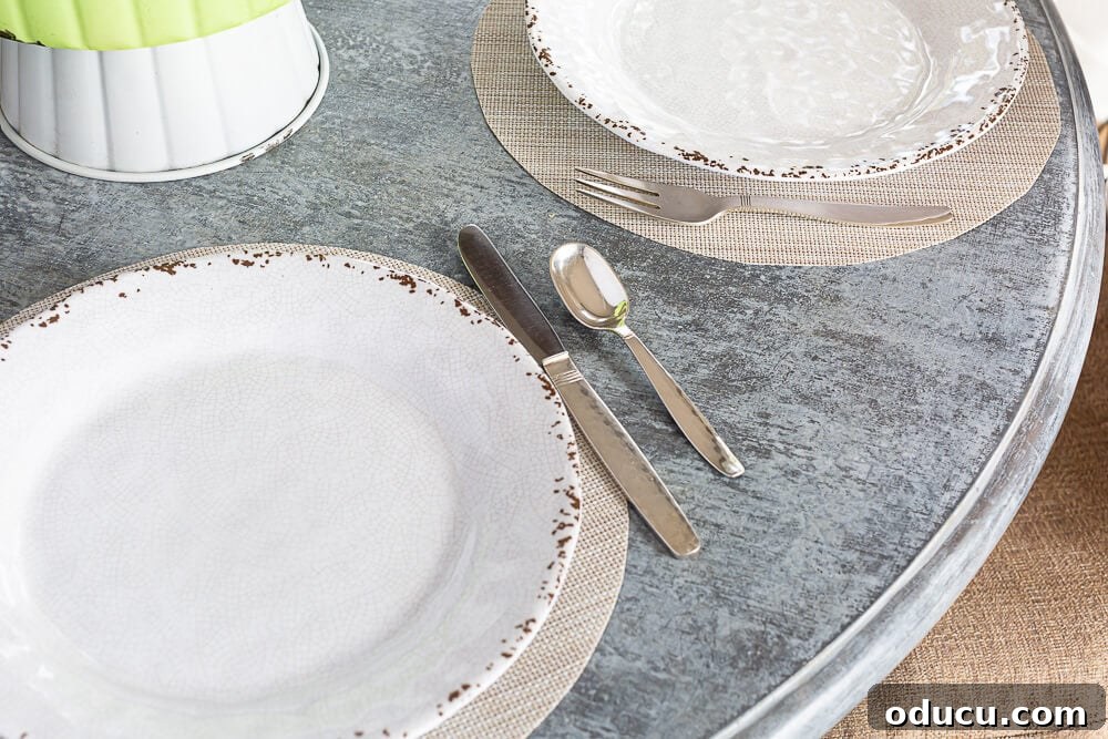 no sew round woven placemats with brunch plates on them on a round faux painted table.