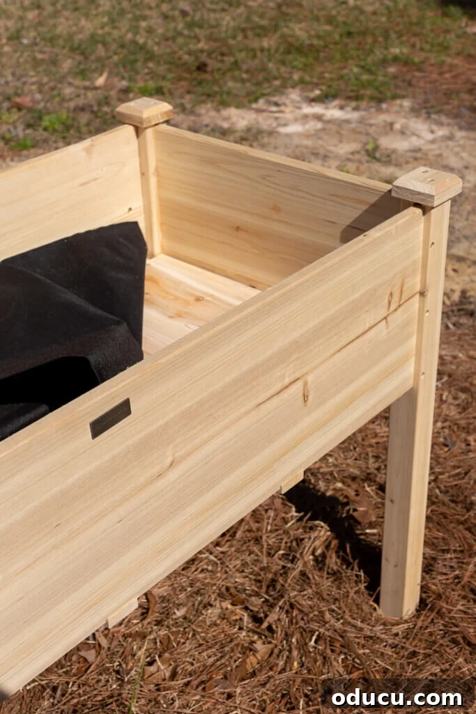 Close-up view of the interior of an assembled cedar elevated planter box, showing the integrated liner.