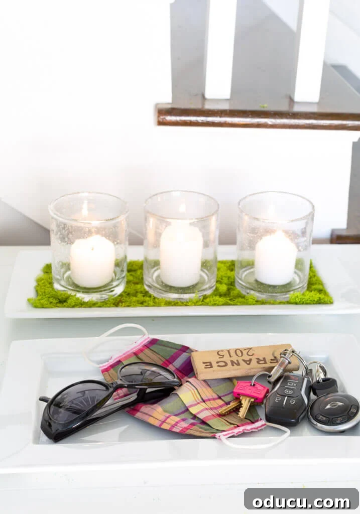 Springtime Glow: DIY Candle Tray 3 Detailed view of a modern spring candle tray holder, showcasing three candles in glasses set on a moss-lined tray.