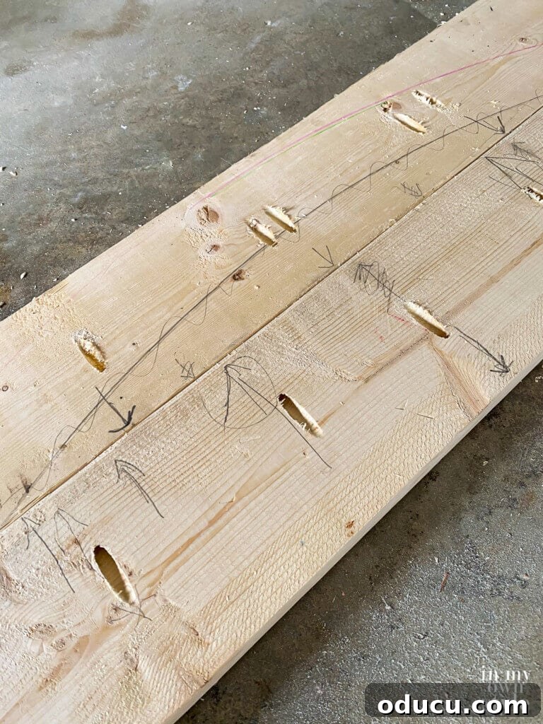 Crafting a Custom Round Wood Kitchen Tabletop 14 Close up of attaching boards to create a wood top for a dining table.