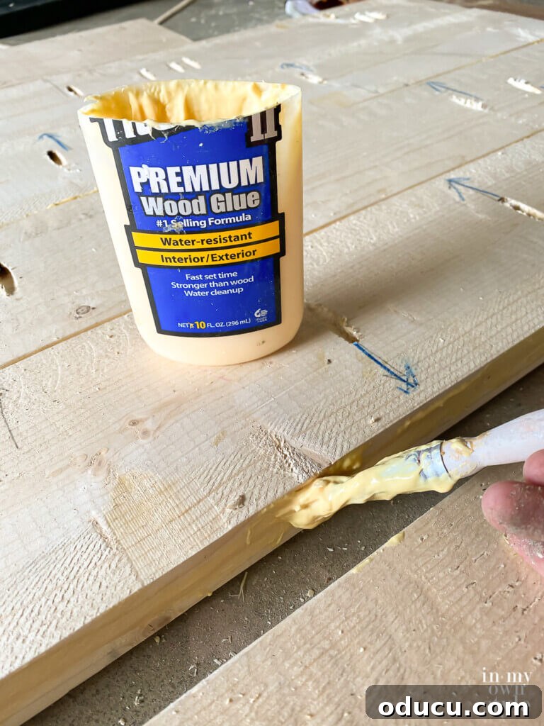 Crafting a Custom Round Wood Kitchen Tabletop 15 Add wood glue between each board before installing pocket hole screws