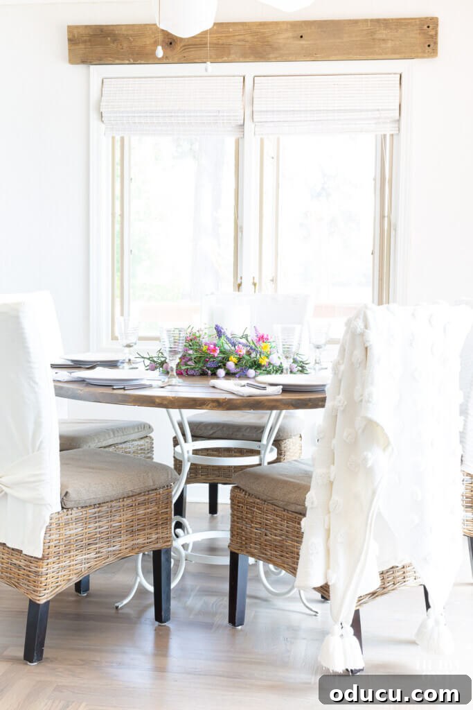 Crafting a Custom Round Wood Kitchen Tabletop 33 DIY round wood table attached to a white metal base. Chairs around the table.