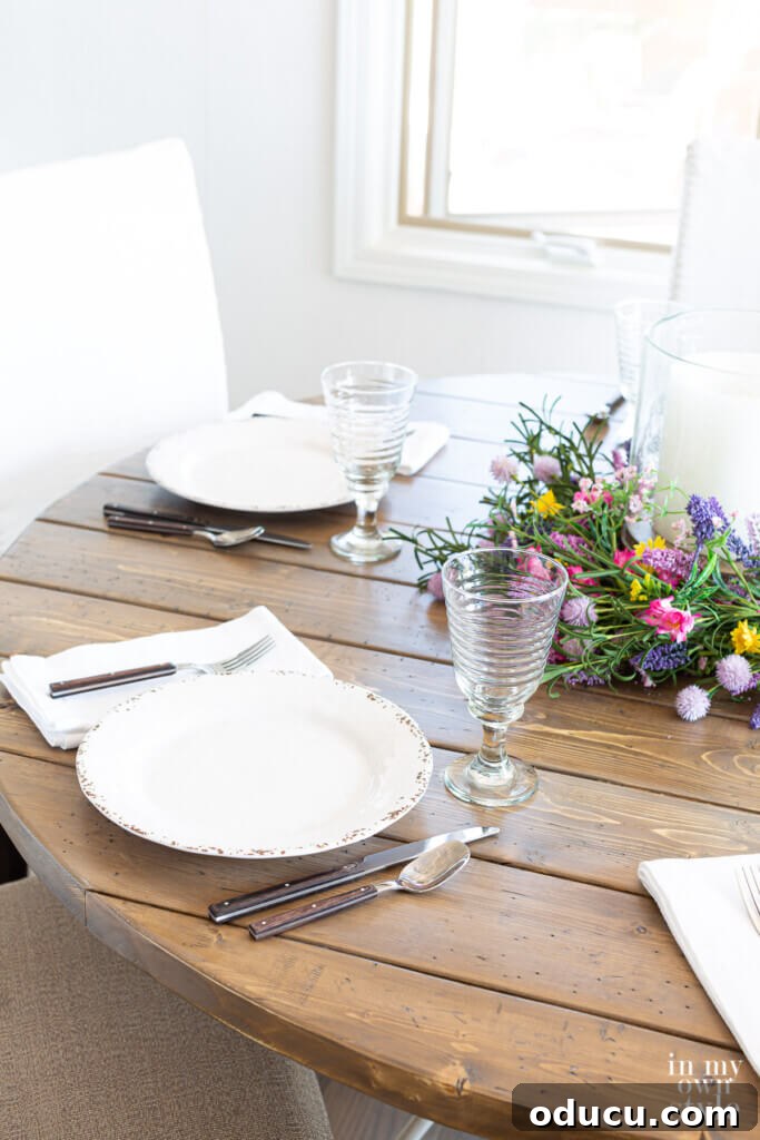 Crafting a Custom Round Wood Kitchen Tabletop 5 Completed DIY round wood table top set for dinner.