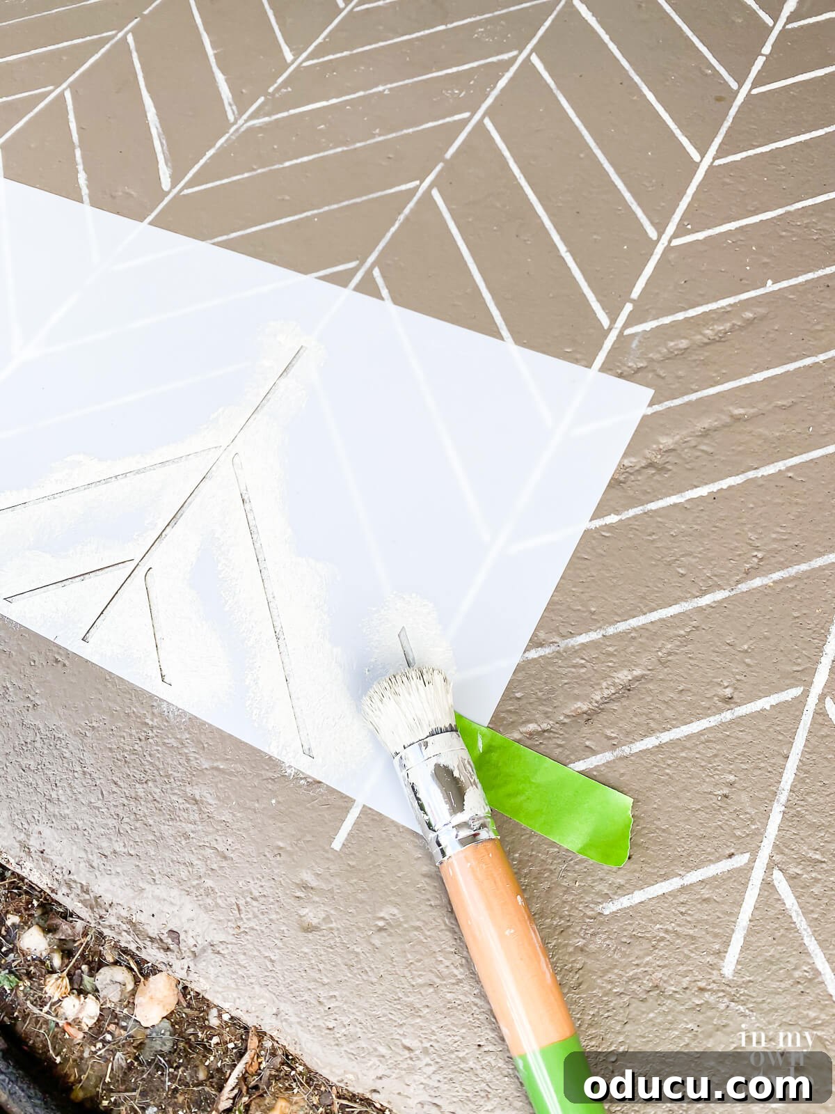 Transform Your Concrete Porch or Patio with Paint and Stencils 11 How to use a stencil to paint a concrete floor.
