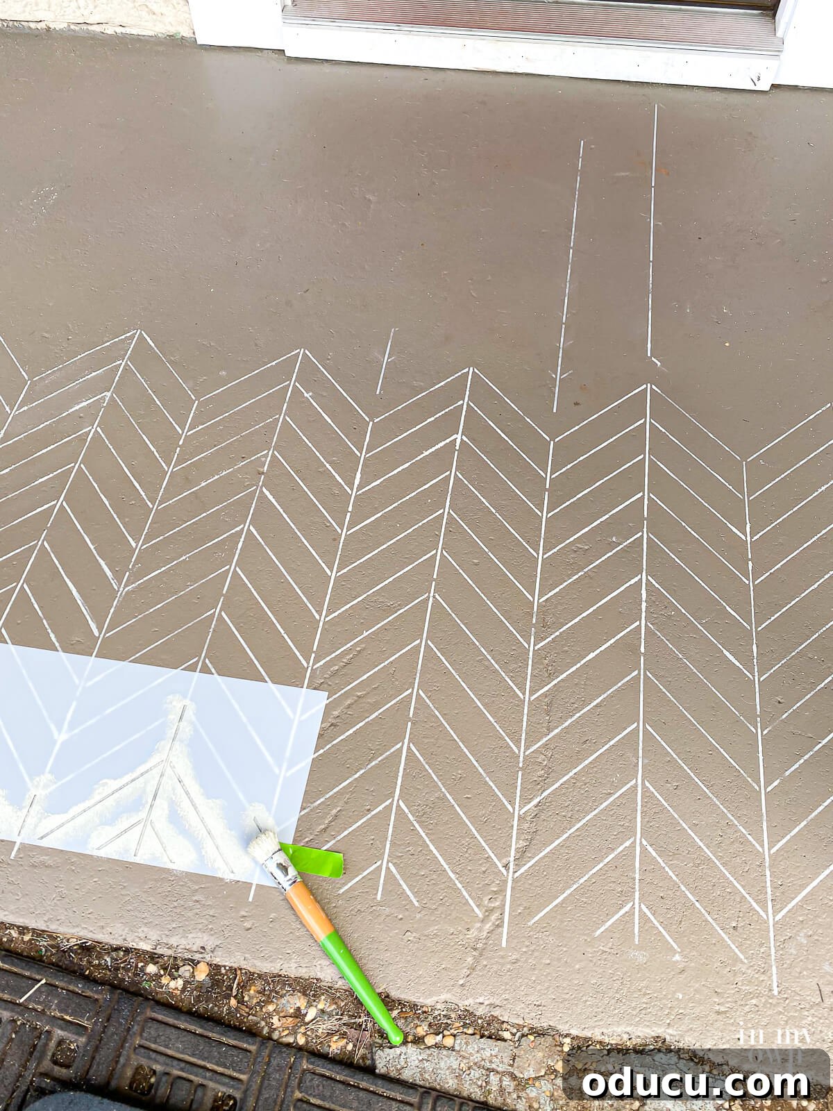 Using a large all over stencil on a porch floor and performing meticulous touch-ups