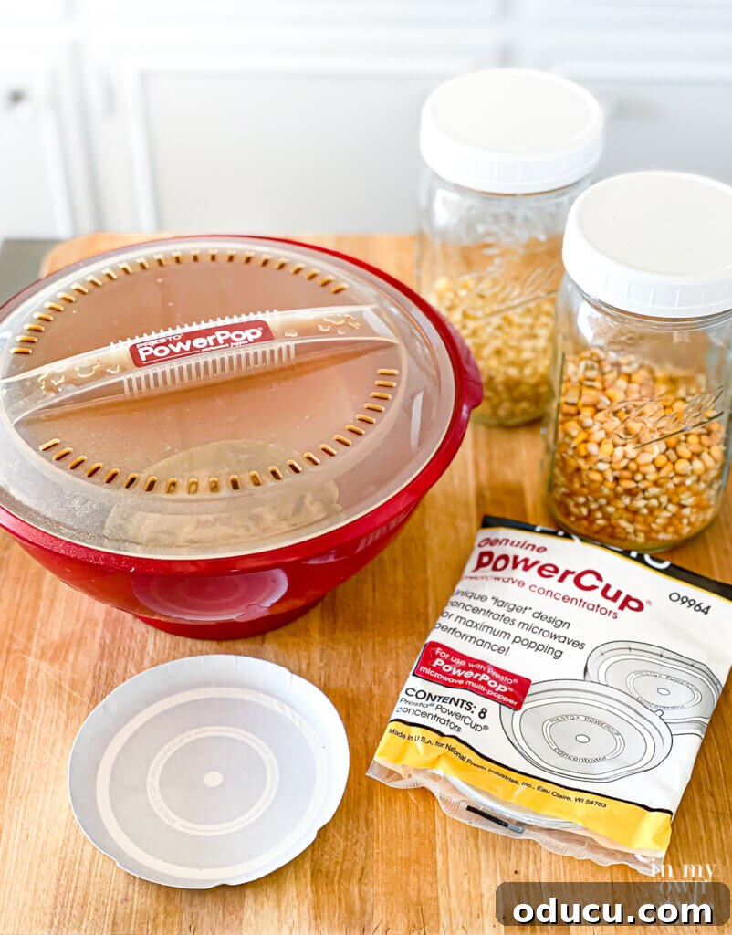 A dedicated microwave popcorn popper and unpopped popcorn kernels, ready for a healthy, oil-free snack preparation.