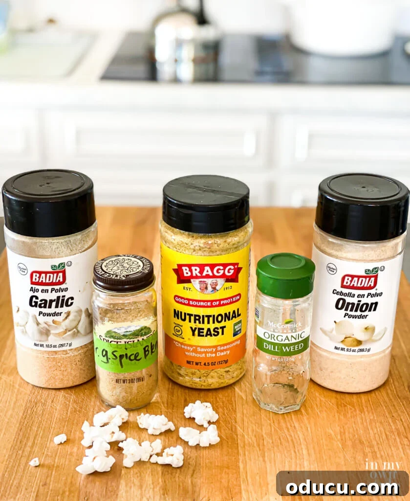 An array of no-salt and low-salt popcorn seasonings including nutritional yeast, various dried herbs, and liquid aminos, displayed next to a small spray bottle for application, emphasizing healthy and flavorful options for air-popped popcorn.