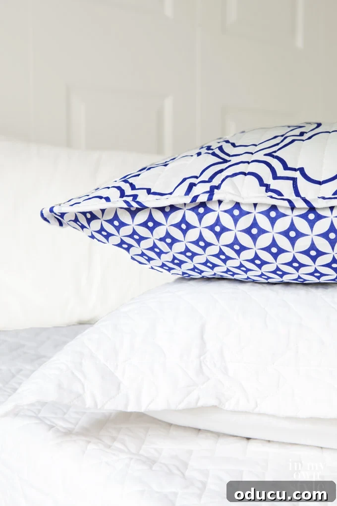 Personalize Your Sanctuary: Mix & Match Bedding 4 Blue and white bed pillow shams with reversible design.