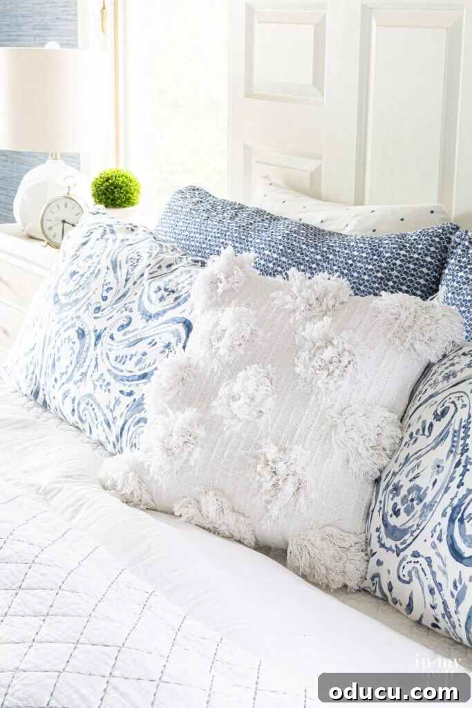 Personalize Your Sanctuary: Mix & Match Bedding 5 picture of pillows on a bed showing how to mix and match bedding on a bed using color, texture and pattern.