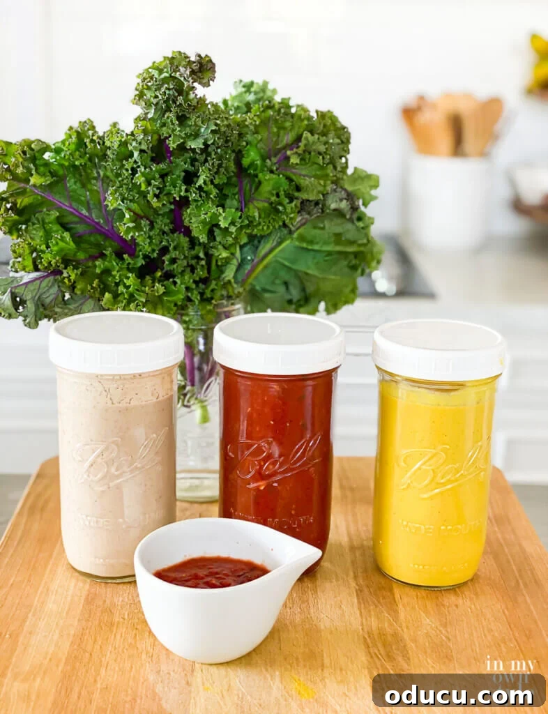 3 Whole Food Plant Based No Oil Sauces and Dressings in Mason Jars on kitchen counter.
