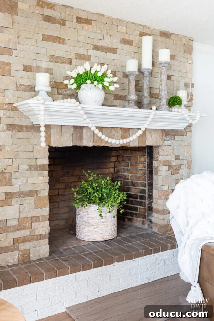 How to style a summer mantel using carefully curated neutral colors and textures for a minimalist yet inviting feel.