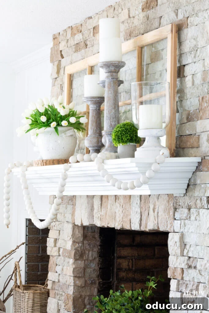 Side view of a beautifully decorated stone fireplace, showcasing a harmonious green and white color scheme perfect for summer.