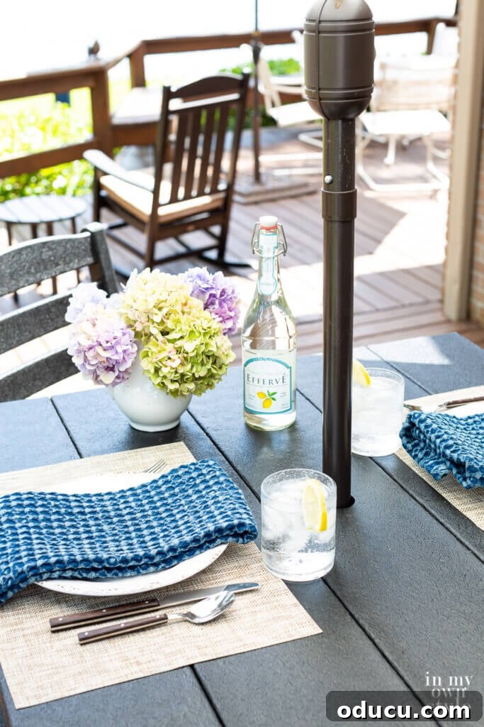 Transforming My Deck with POLYWOOD Outdoor Furniture 11 A stylish black POLYWOOD bar height outdoor dining set arranged on a deck, inviting alfresco dining and social gatherings.