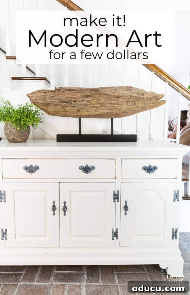 Craft a Natural Driftwood Art Display 17 Driftwood sculpture on a stand prominently displayed on a foyer sideboard, enhancing the modern aesthetic.