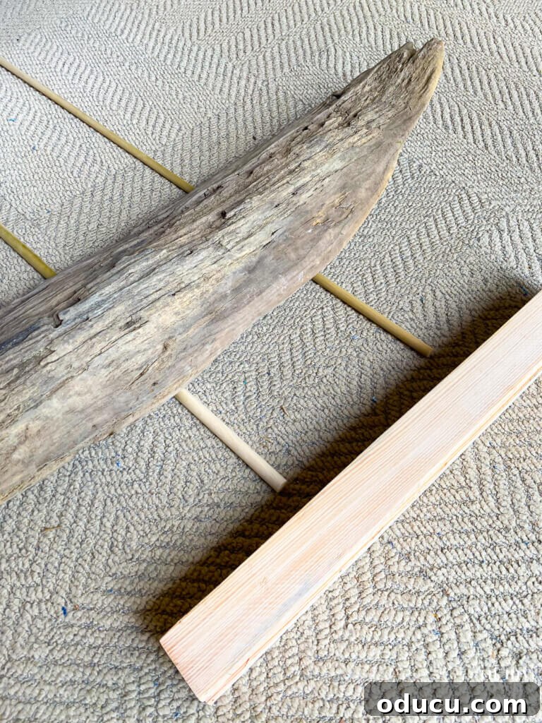 Craft a Natural Driftwood Art Display 10 Visualizing the arrangement: positioning the driftwood, dowels, and base on a work surface before assembly.
