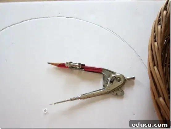 Using a compass to cut foam board into a perfect circle shape for a round tray insert.