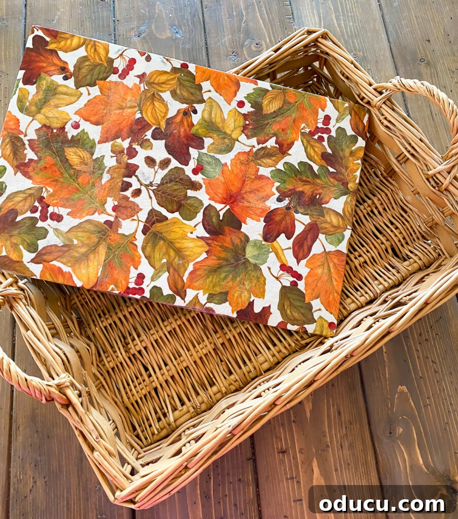 Crafting Versatile Serving Trays for Every Occasion 4 Fall paper napkins vinylized insert in a wicker tray basket, showcasing stability for items.