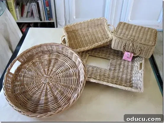 Crafting Versatile Serving Trays for Every Occasion 6 Collection of wicker trays and baskets found at a thrift store, awaiting transformation.