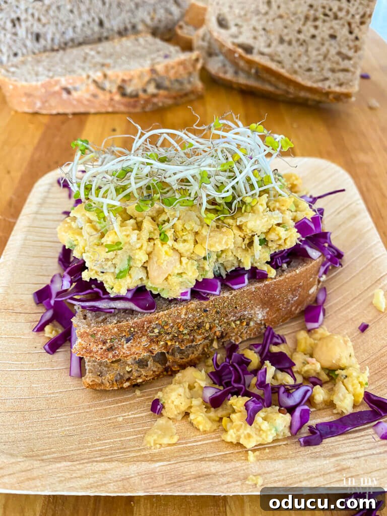 Savory Vegan Deli Chickpea Sandwich WFPB Approved 2 Delicious smashed chickpea salad sandwich on sourdough bread, a perfect vegan lunch option.