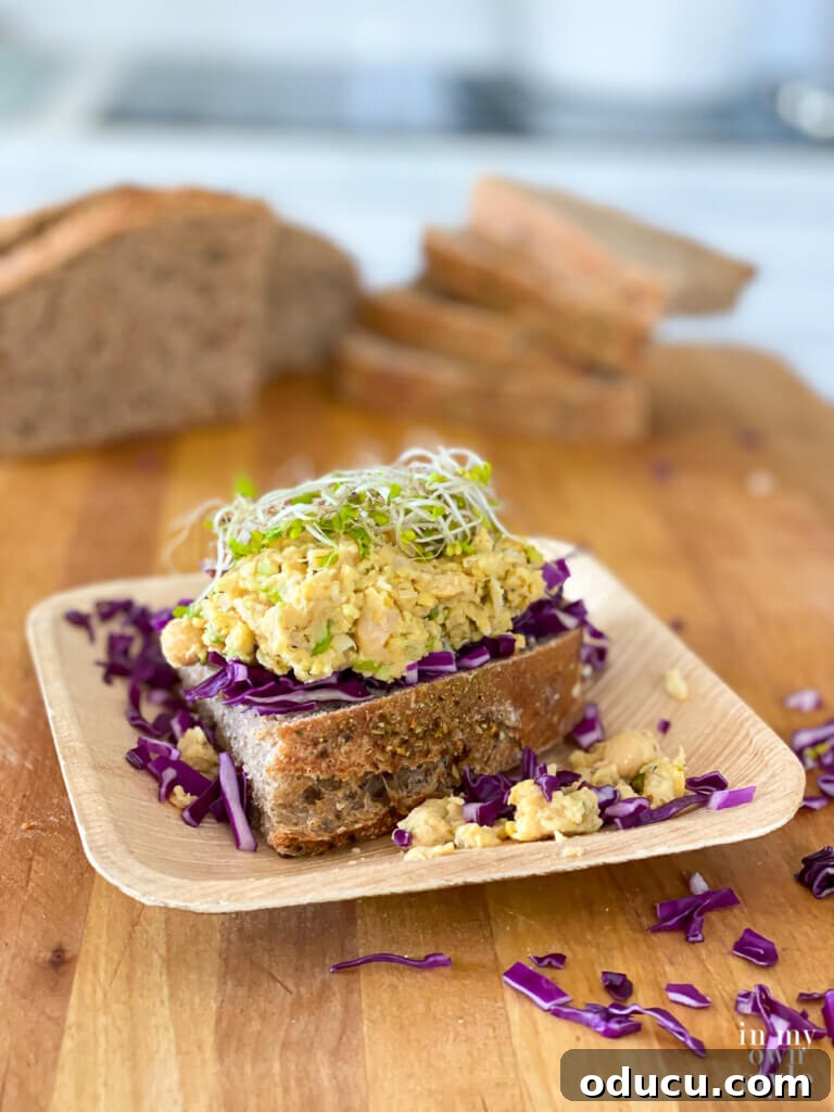 Savory Vegan Deli Chickpea Sandwich WFPB Approved 3 Smashed chickpea salad sandwich served deli style, showcasing its hearty and appealing presentation.