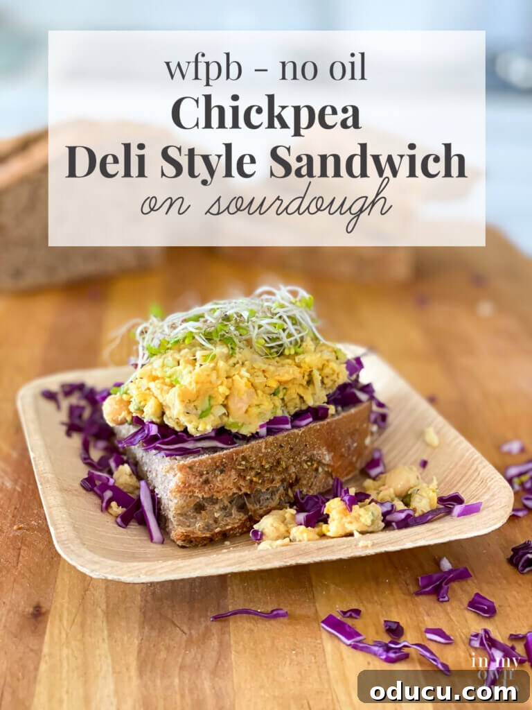 Savory Vegan Deli Chickpea Sandwich WFPB Approved 5 Beautifully presented smashed chickpea deli-style sandwich, highlighting the fresh, whole food plant-based ingredients.
