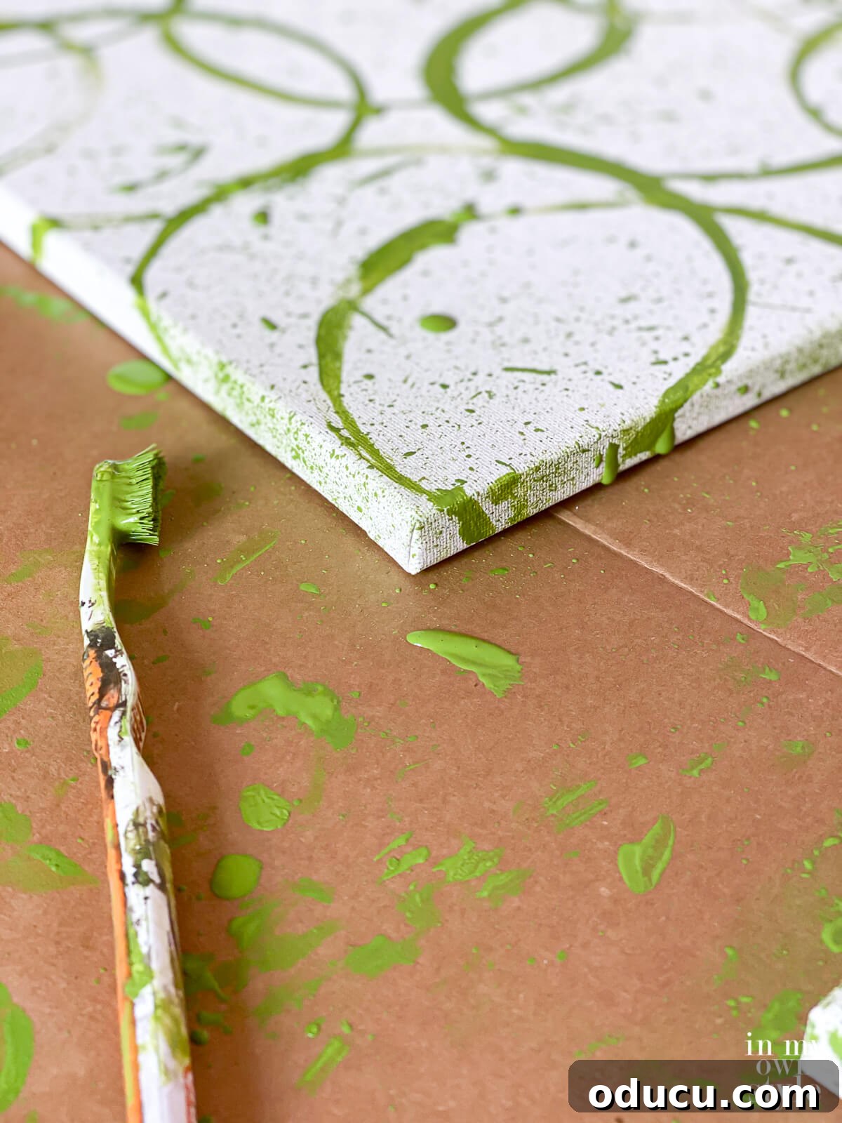 Splatter paint technique to create your own modern wall art on a canvas.