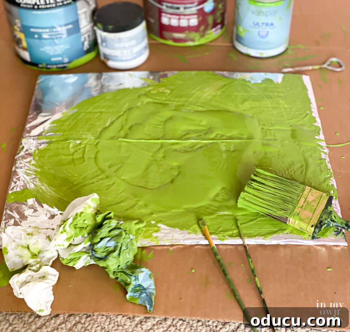 Paint palette made on a piece of cardboard covered with foil.