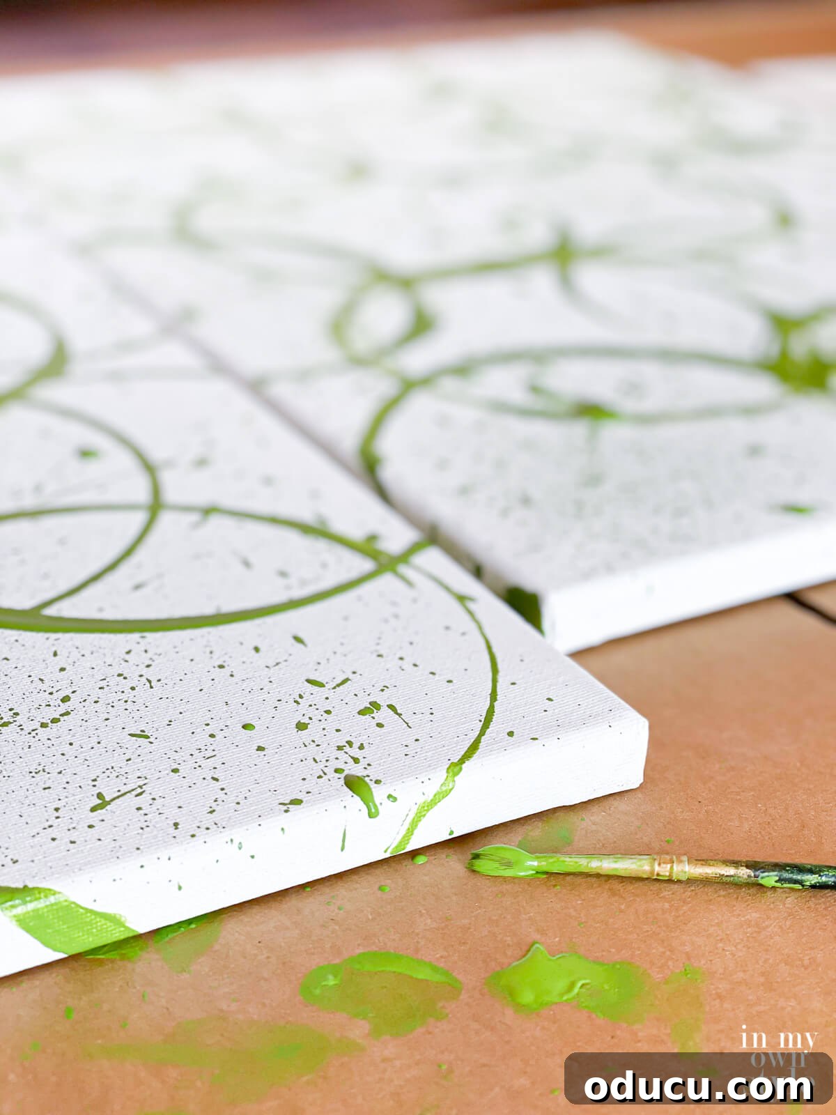 Close up of how to paint the sides of the canvas when making your own modern wall art.
