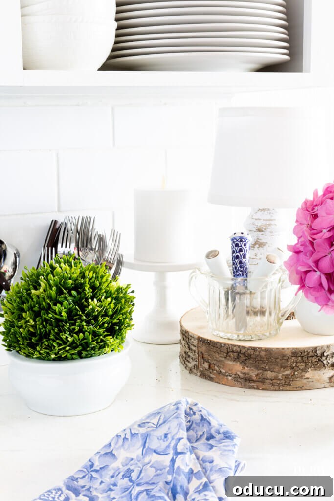 Kitchen Counter Harmony: Blending Function and Style 4 A few decorative items on a kitchen white counter.