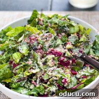 Vibrant Vegan Roasted Beet and Leek Salad 4 Close-up of a small white salad plate showcasing a portion of warm roasted beet and leek salad with quinoa and creamy cashew dressing.