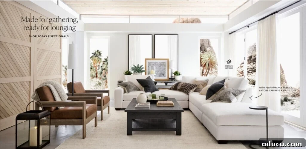 Style Scouting Volume 51 2 Two large mirrors strategically placed behind a sofa in a stylish living room setting.