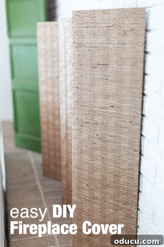 DIY Fireplace Cover Seamlessly Built 15 Grasscloth covered folding screen for a DIY summer fireplace cover.
