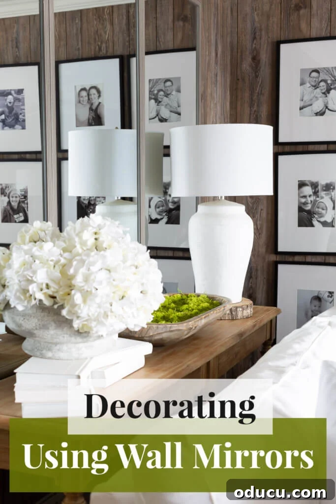 Grand Living Room on a Small Budget: $240 Makeover 12 A beautifully styled living room console table, elegantly positioned in front of a wall of mirrors, emphasizing expansive space.