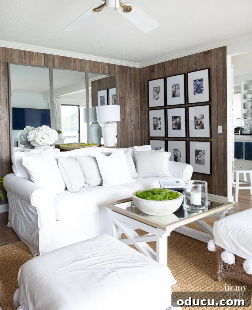 Grand Living Room on a Small Budget: $240 Makeover 5 Innovative living room wall decor featuring multiple mirrors, strategically placed to expand the perception of space.